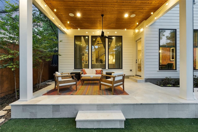 view of patio with fence, a ceiling fan, and an outdoor hangout area