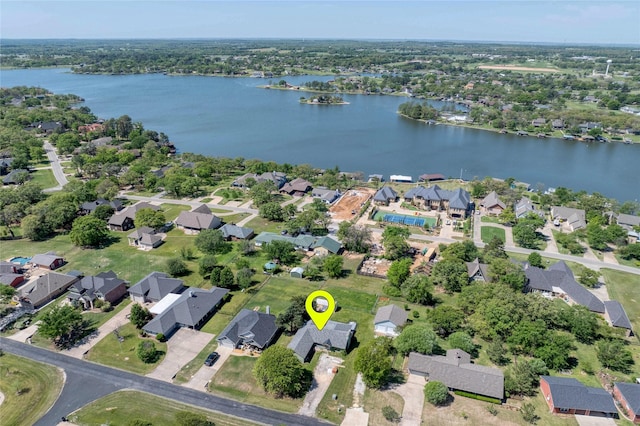 birds eye view of property with a water view and a residential view