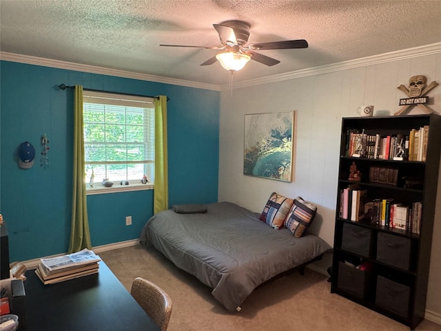 bedroom with ornamental molding, ceiling fan, carpet floors, and a textured ceiling