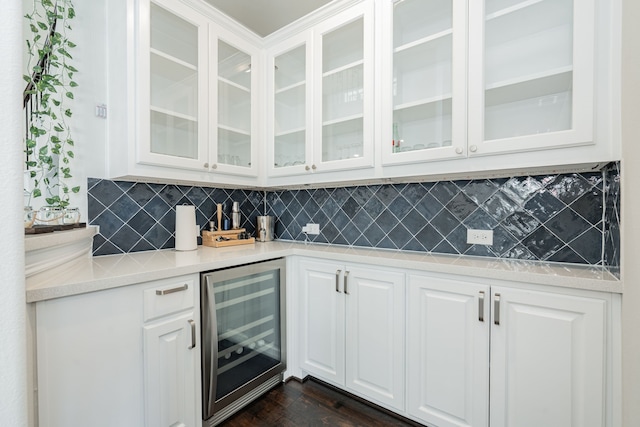 bar with backsplash, beverage cooler, and dark wood-style floors