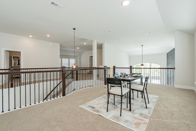 dining area featuring light colored carpet, a notable chandelier, visible vents, and recessed lighting