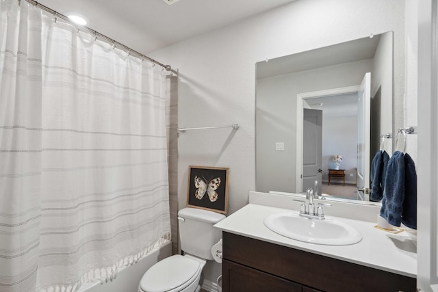 full bath with shower / bath combo, toilet, and vanity