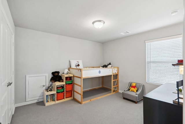 bedroom with visible vents and carpet flooring