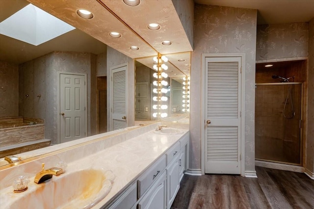 275 Salesville Rd, Mineral Wells, TX 76067 - full bathroom with wood finished floors, a sink, a closet, and a stall shower