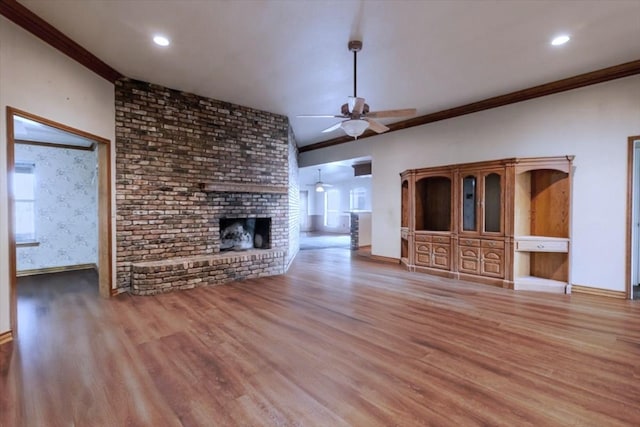 275 Salesville Rd, Mineral Wells, TX 76067 - unfurnished living room with wood finished floors, a brick fireplace, a ceiling fan, and ornamental molding