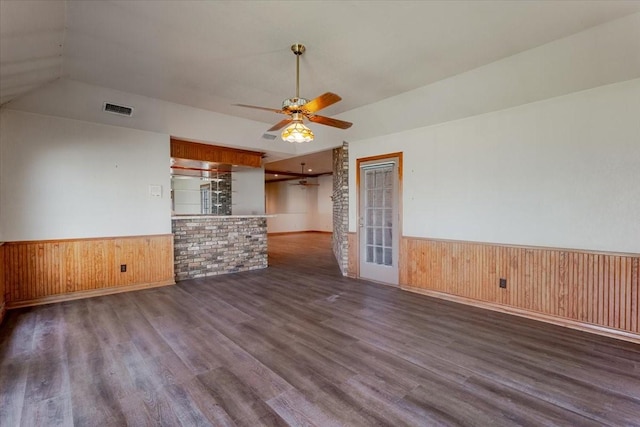 275 Salesville Rd, Mineral Wells, TX 76067 - unfurnished living room featuring wood finished floors, a wainscoted wall, ceiling fan, and wood walls