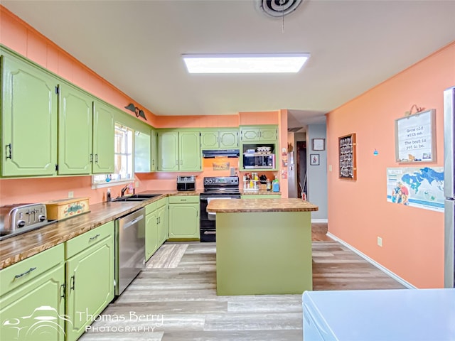 kitchen with a sink, black range with electric stovetop, a center island, light wood-style flooring, and dishwasher