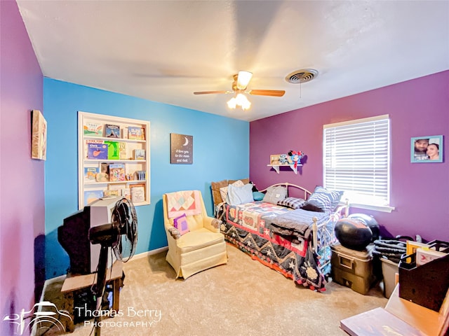 carpeted bedroom with visible vents and ceiling fan