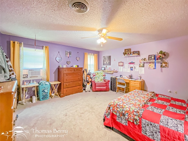 carpeted bedroom with visible vents, cooling unit, a textured ceiling, and multiple windows