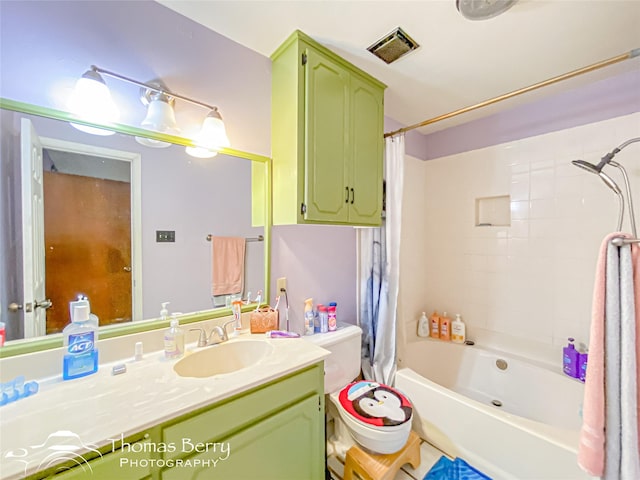 bathroom featuring shower / bathtub combination with curtain, visible vents, and vanity