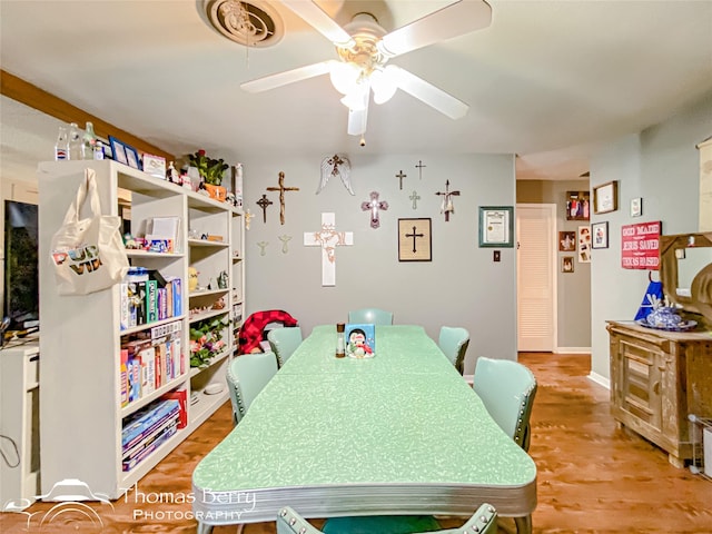 dining room featuring wood finished floors and a ceiling fan