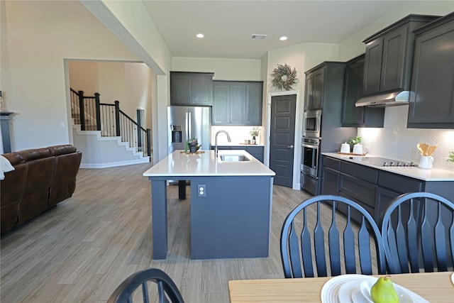 645 Summer Grove Dr, Midlothian, TX 76065 - kitchen featuring a sink, stainless steel appliances, light countertops, backsplash, and recessed lighting