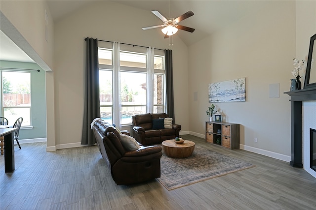 645 Summer Grove Dr, Midlothian, TX 76065 - living area featuring a ceiling fan, a fireplace, high vaulted ceiling, wood finished floors, and baseboards