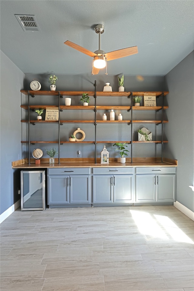 645 Summer Grove Dr, Midlothian, TX 76065 - indoor bar featuring baseboards, wood tiled floors, and ceiling fan