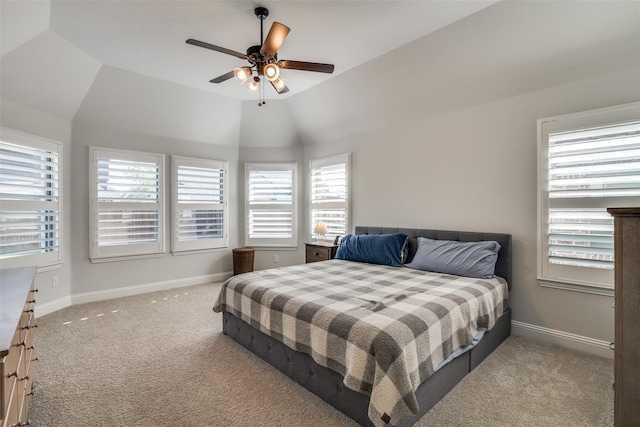 bedroom featuring ceiling fan, baseboards, vaulted ceiling, and carpet floors
