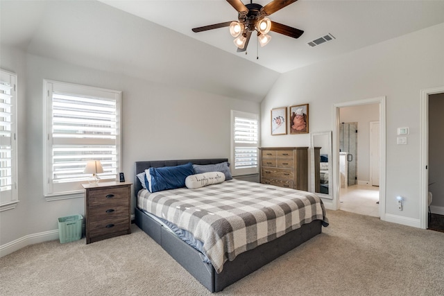 carpeted bedroom with visible vents, baseboards, ceiling fan, and vaulted ceiling