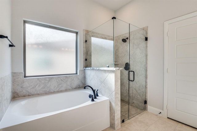 full bath featuring a bath, a wealth of natural light, and a stall shower