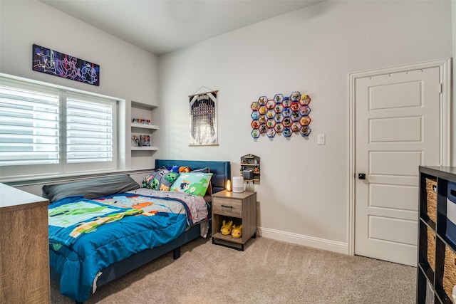 bedroom with baseboards and carpet floors