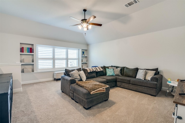 carpeted living room featuring visible vents, baseboards, a ceiling fan, and lofted ceiling