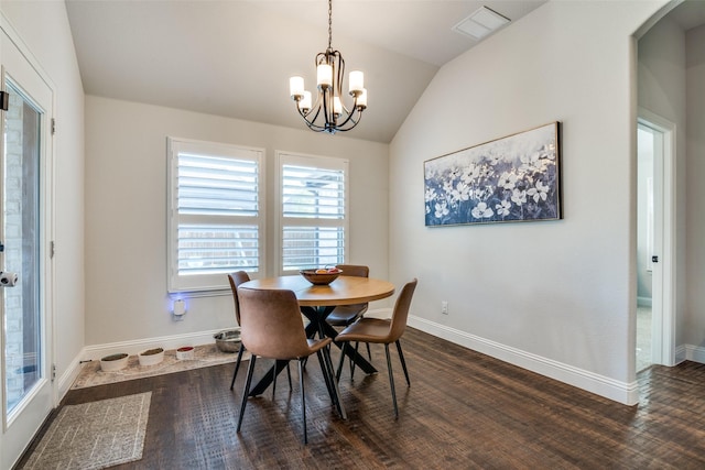 dining space featuring dark wood finished floors, baseboards, an inviting chandelier, and lofted ceiling