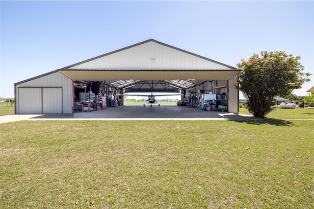 exterior space with an outbuilding and a garage