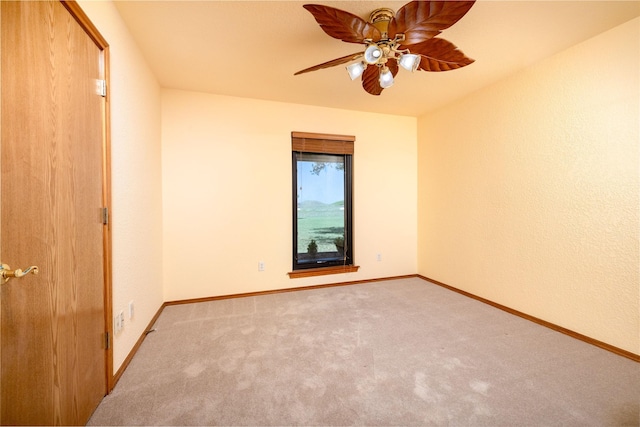 unfurnished bedroom featuring ceiling fan, carpet floors, and baseboards