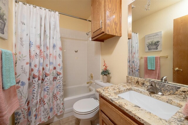 full bathroom with vanity, toilet, shower / bath combination with curtain, and tile patterned flooring
