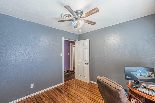 1206 John Reagan St, Benbrook, TX 76126 - office with wood finished floors, baseboards, ceiling fan, and a textured wall