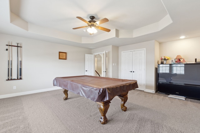 playroom featuring a tray ceiling, ceiling fan, baseboards, and carpet floors