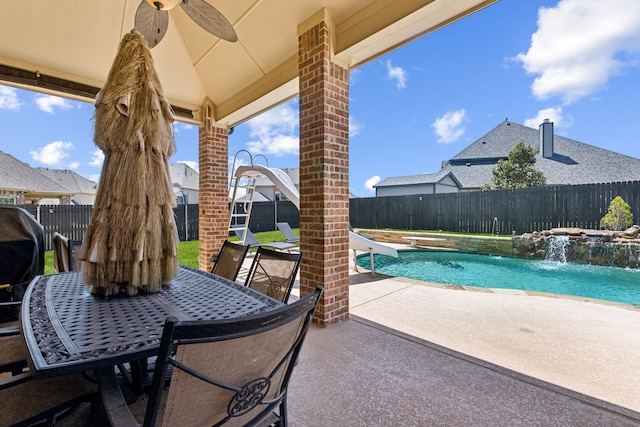 703 Sierra Ave, Mansfield, TX 76063 - fenced backyard featuring ceiling fan, a patio, and outdoor dining space