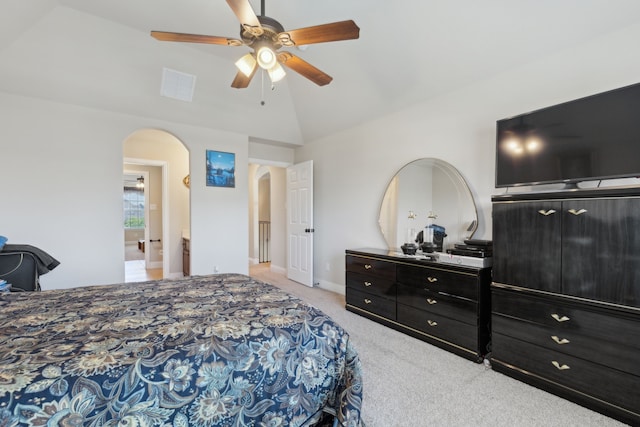 carpeted bedroom with baseboards, a ceiling fan, visible vents, high vaulted ceiling, and arched walkways