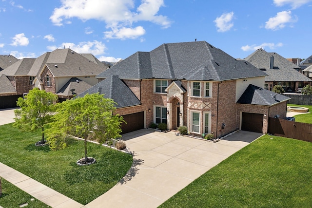 view of front of property featuring a residential view, a front lawn, brick siding, a shingled roof, and concrete driveway