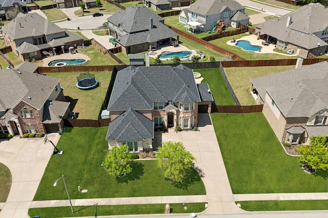 birds eye view of property with a residential view