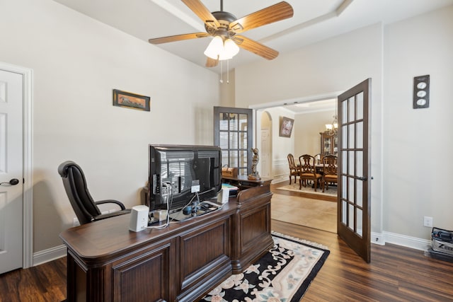 office with ceiling fan, dark wood finished floors, arched walkways, french doors, and baseboards