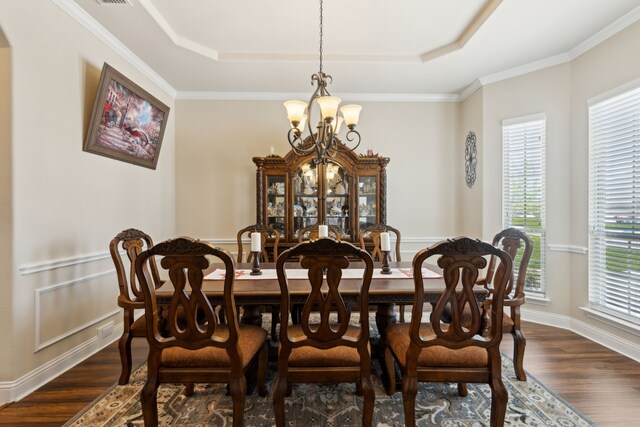 703 Sierra Ave, Mansfield, TX 76063 - dining area featuring a chandelier, a tray ceiling, dark wood-style floors, and ornamental molding