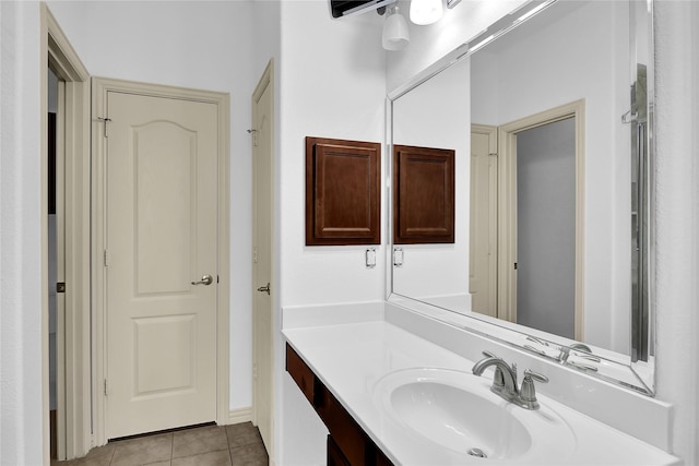 bathroom with tile patterned floors and vanity