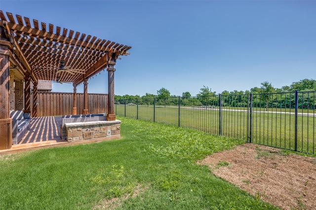 view of yard featuring a pergola, a ceiling fan, and a fenced backyard