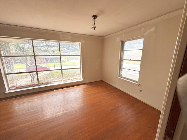 1905 Province Ln, Dallas, TX 75228 - spare room featuring crown molding, wood finished floors, and baseboards