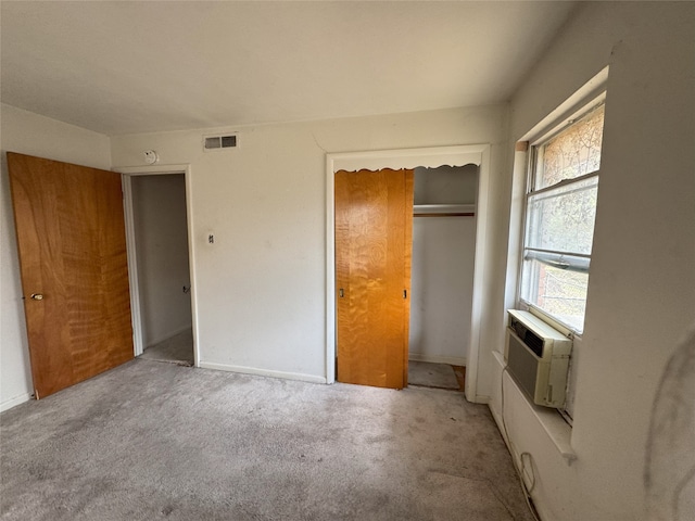 1905 Province Ln, Dallas, TX 75228 - unfurnished bedroom with visible vents, baseboards, a closet, cooling unit, and light carpet