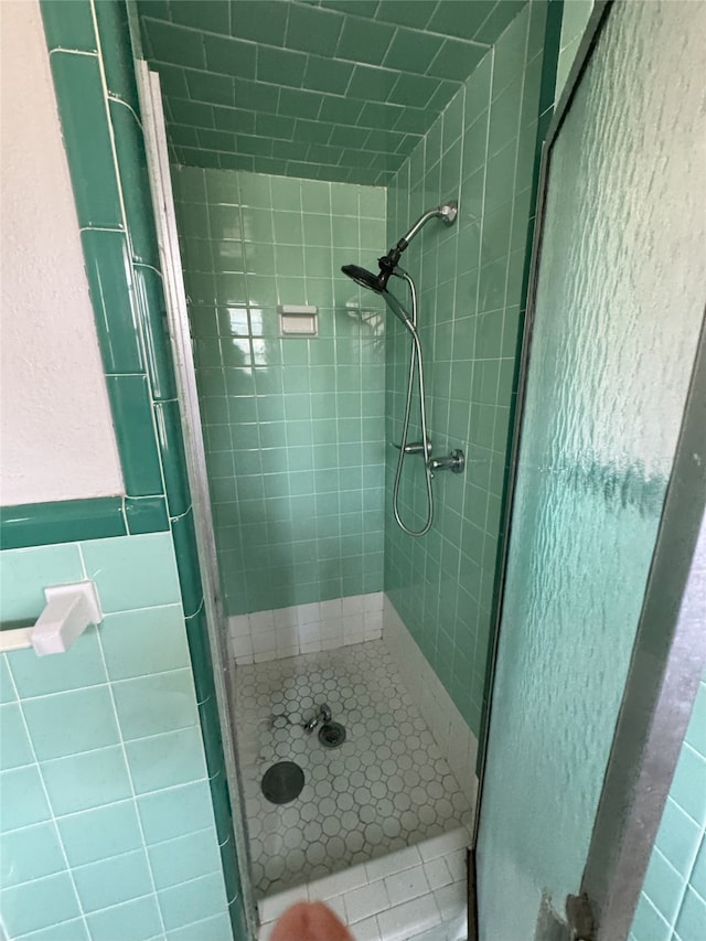 1905 Province Ln, Dallas, TX 75228 - full bath featuring tile walls, a shower stall, and tile patterned flooring
