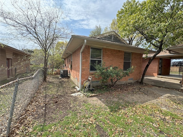 1905 Province Ln, Dallas, TX 75228 - view of side of home featuring cooling unit, fence, crawl space, and brick siding