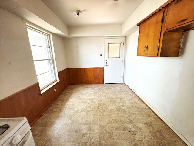 1905 Province Ln, Dallas, TX 75228 - unfurnished dining area featuring wood walls and a wainscoted wall