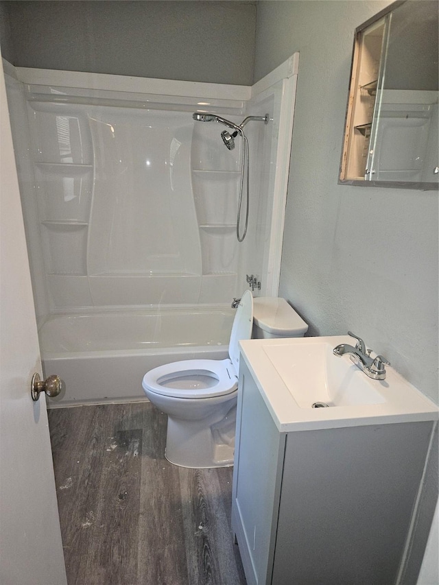 7211 Arborcrest Dr, Dallas, TX 75232 - bathroom with toilet, wood finished floors, vanity, and bathing tub / shower combination
