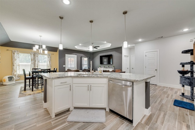 kitchen featuring open floor plan, recessed lighting, wood finish floors, and dishwasher