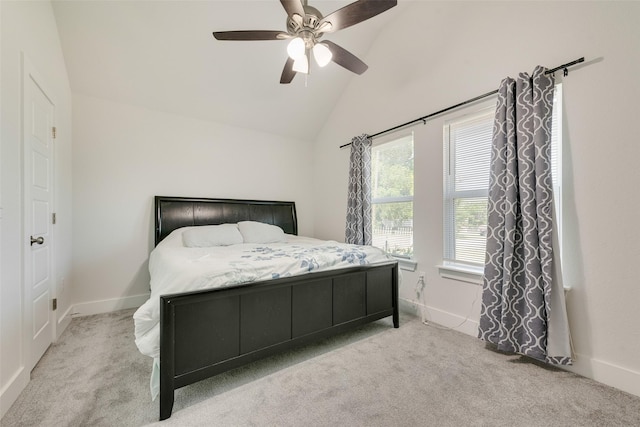 carpeted bedroom with baseboards, vaulted ceiling, and ceiling fan