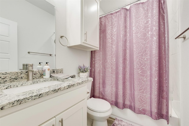 bathroom with shower / tub combo, toilet, and vanity