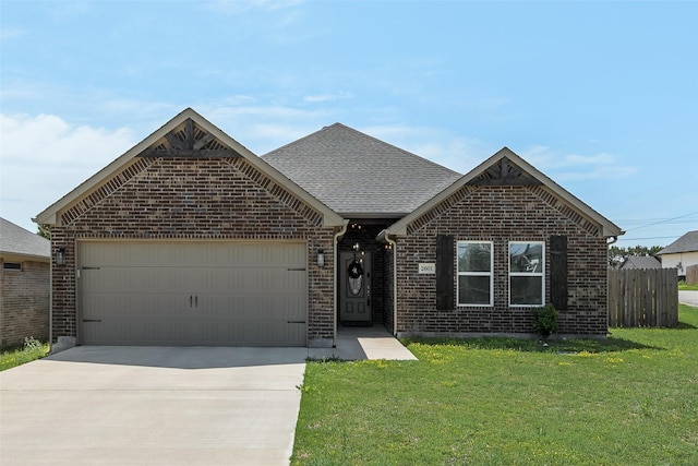 ranch-style house with concrete driveway, fence, brick siding, a garage, and a front yard