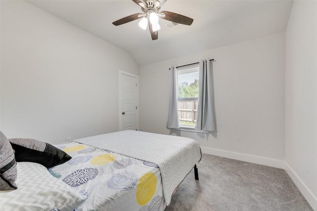 carpeted bedroom with ceiling fan, visible vents, baseboards, and vaulted ceiling