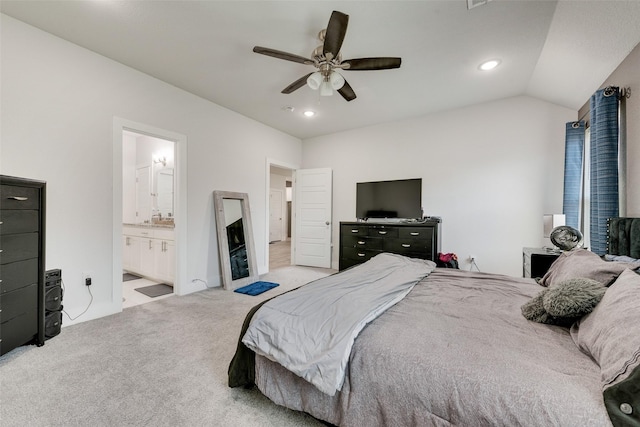 carpeted bedroom with a sink, ceiling fan, recessed lighting, ensuite bath, and vaulted ceiling