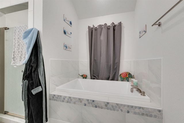 bathroom featuring a garden tub